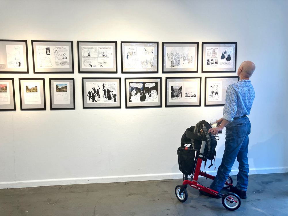 Exhibition visitor in front of works from the graphic novel series “Gestern haben wir viel getanzt” (“Yesterday we danced a lot”) by illustrator Nathalie Frank, Berlin 2023.